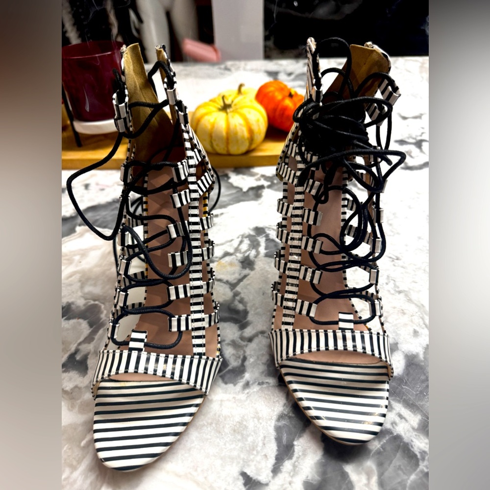 Women’s shiny black and white striped heels. Never worn!